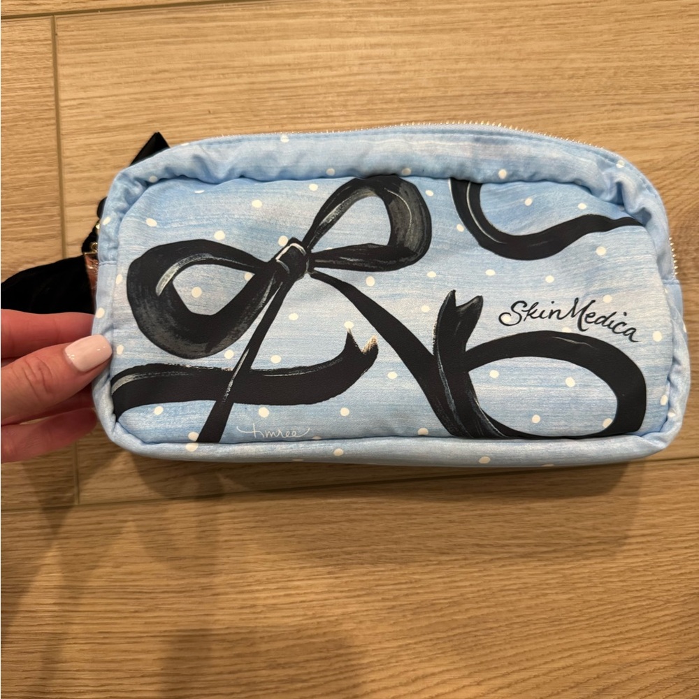 SkinMedica Light Blue Cosmetic Pouch with black bow